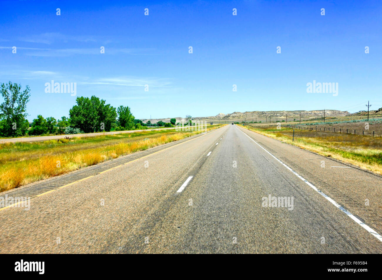 Interstate 94 in North Dakota, perhaps one of the straightest roads in America Stock Photo
