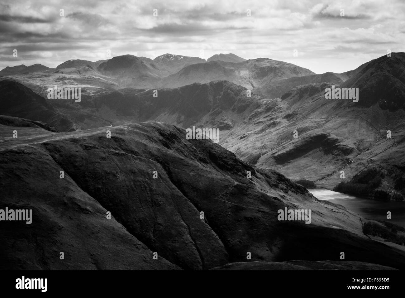 looking across to the scafell mountain range from whiteless pike Stock Photo