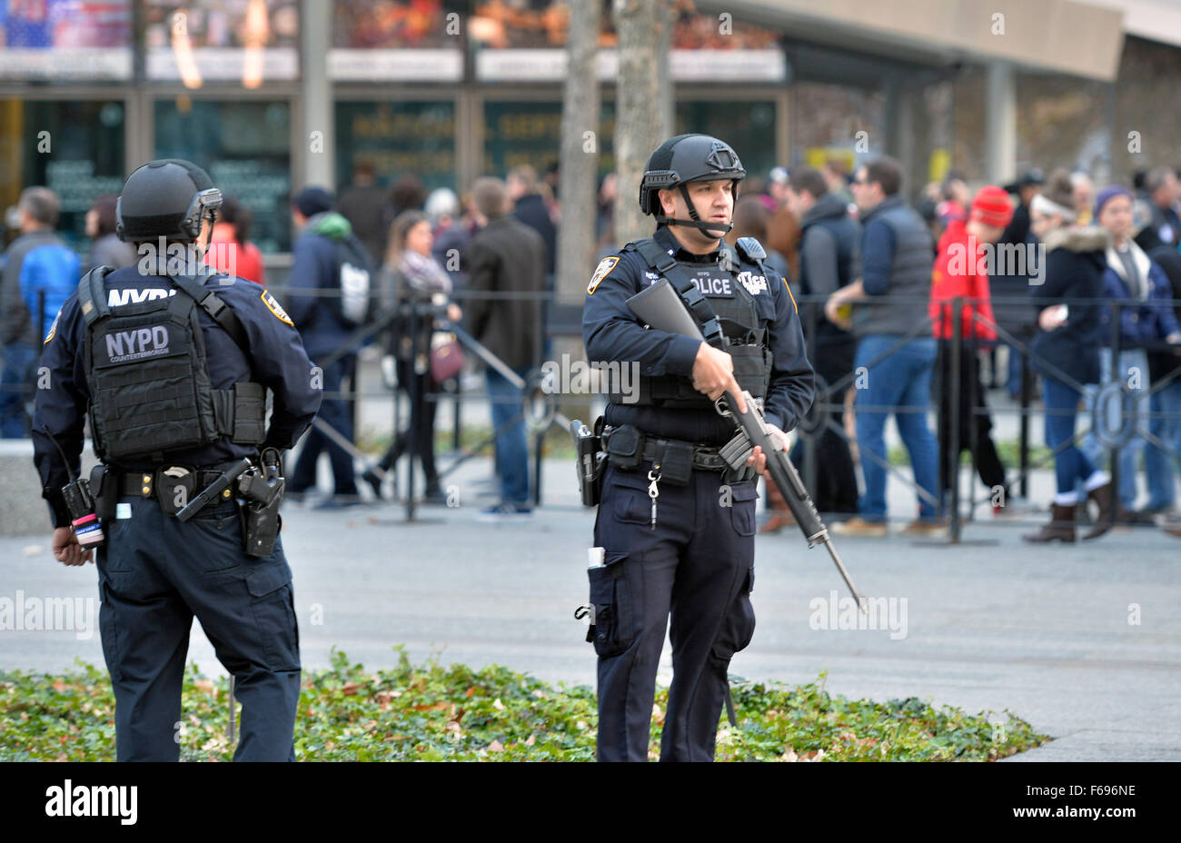 New York, USA. 14th Nov, 2015. Two NYPD armed police officers stand guard near the 9/11 Memorial Museum in Manhattan, New York City, the United States, Nov. 14, 2015. The NYPD Counterterrorism Response Command (CRC), the Critical Response Group (SRG), and Operation Hercules Teams have been dispatched to crowded areas around the city as a precaution after the deadly series of attacks hit Paris on Friday night. © Wang Lei/Xinhua/Alamy Live News Stock Photo
