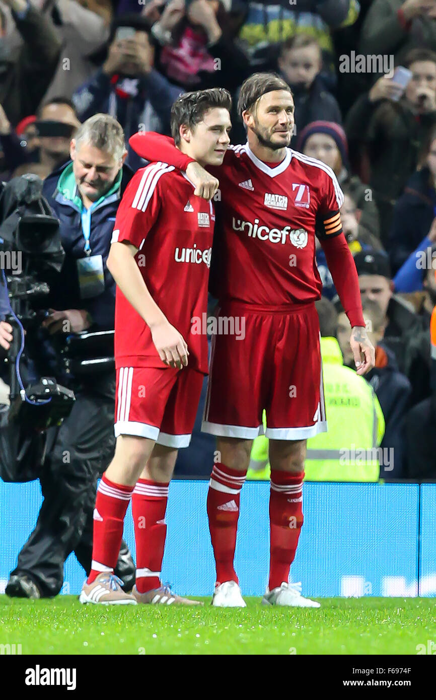 Old Trafford, Manchester, UK. 14th Nov, 2015. Unicef Match for Children. GB and NI XI versus Rest of the World XI. David Beckham with his son Brooklyn Beckham after the final whistle © Action Plus Sports/Alamy Live News Stock Photo