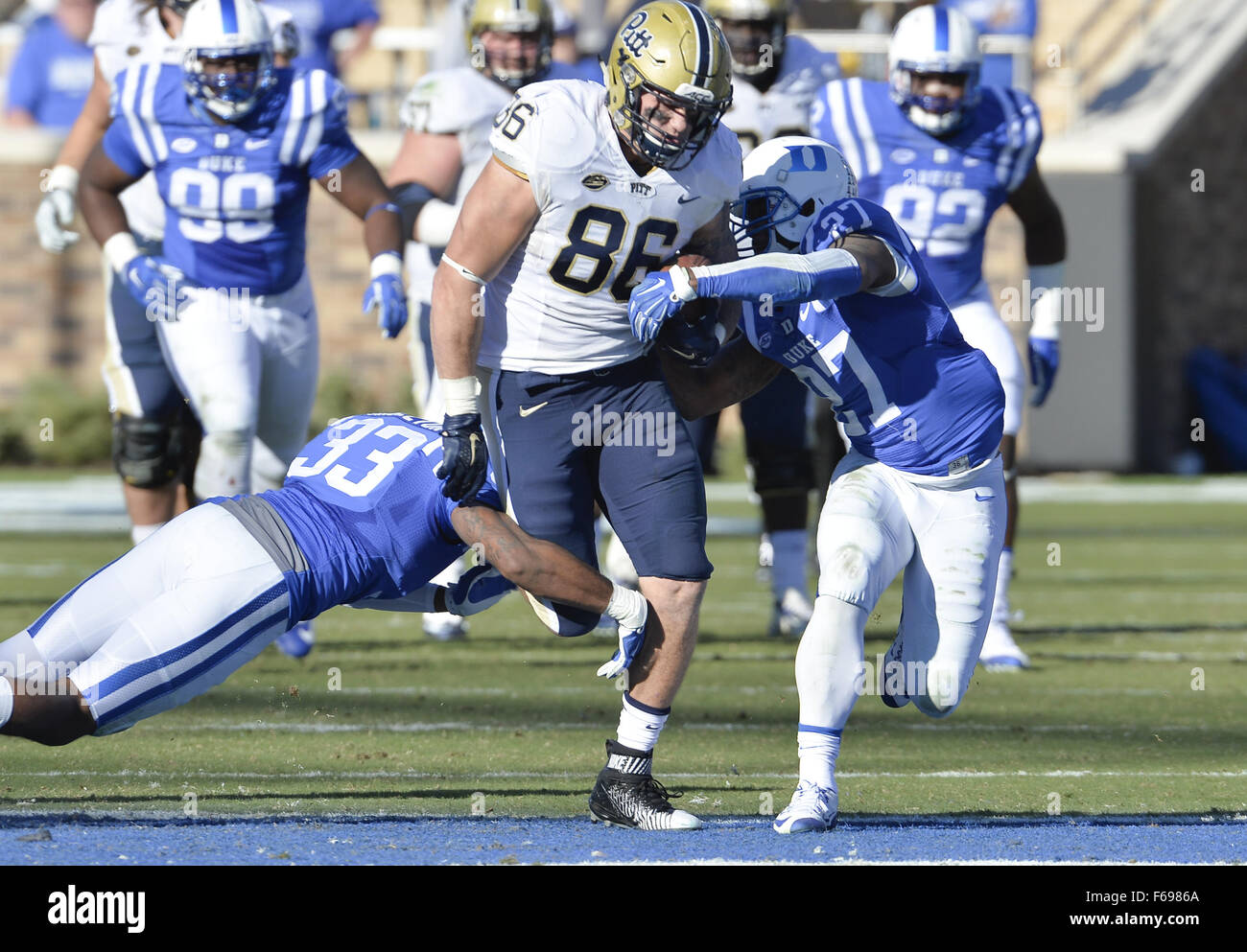 Durham, North Carolina, USA. 14th Nov, 2015. J.P. Holtz (86) of Pittsburgh moves the ball against DeVon Edwards (27) and Deondre Singleton (33) of Duke. The Duke Blue Devils hosted the University of Pittsburgh Panthers at the Wallace Wade Stadium in Durham, N.C. Pittsburgh won 31-13. Credit:  Fabian Radulescu/ZUMA Wire/Alamy Live News Stock Photo