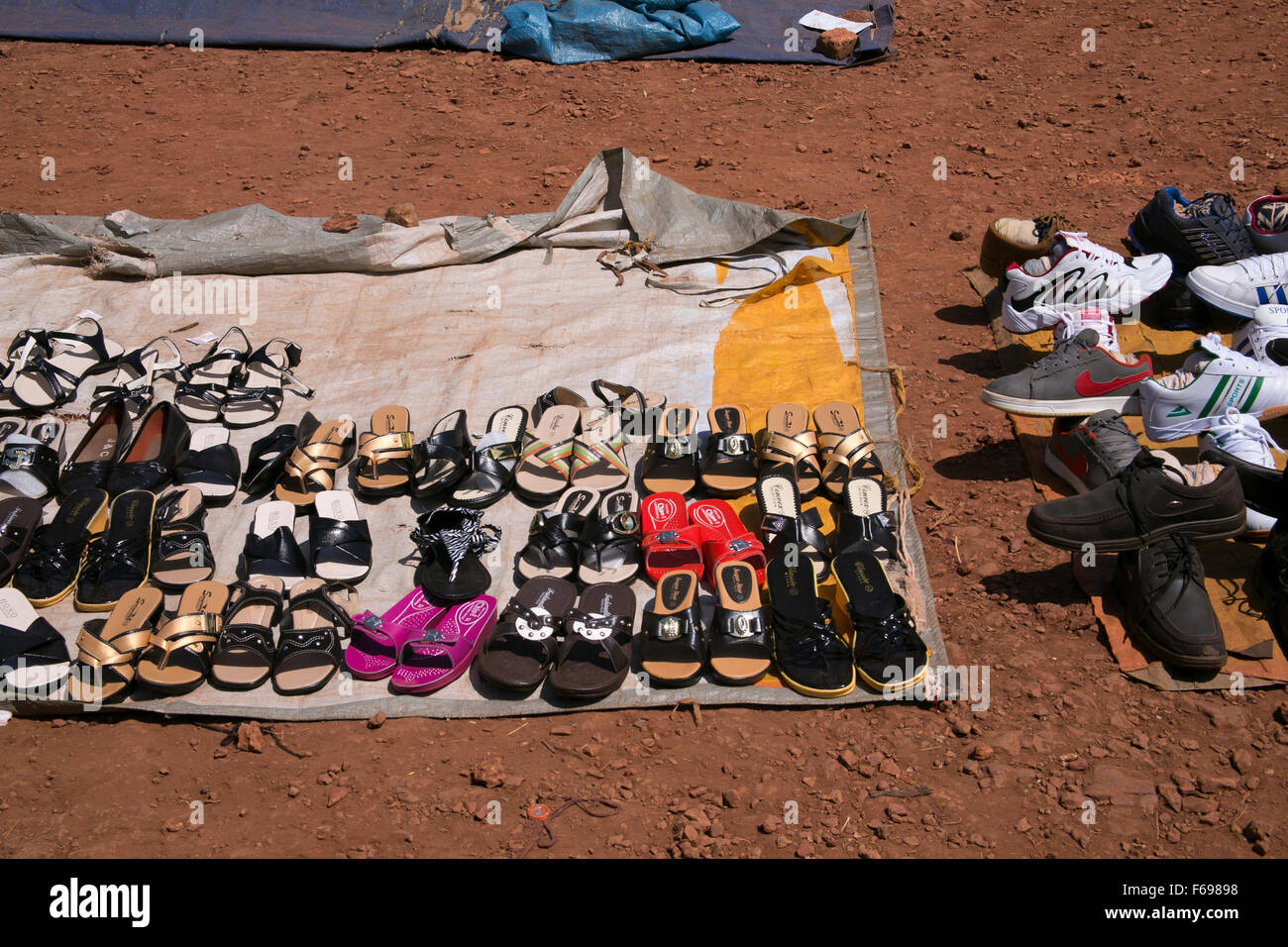 Shoes for sale in the market in Kayonza, Rwanda. Stock Photo
