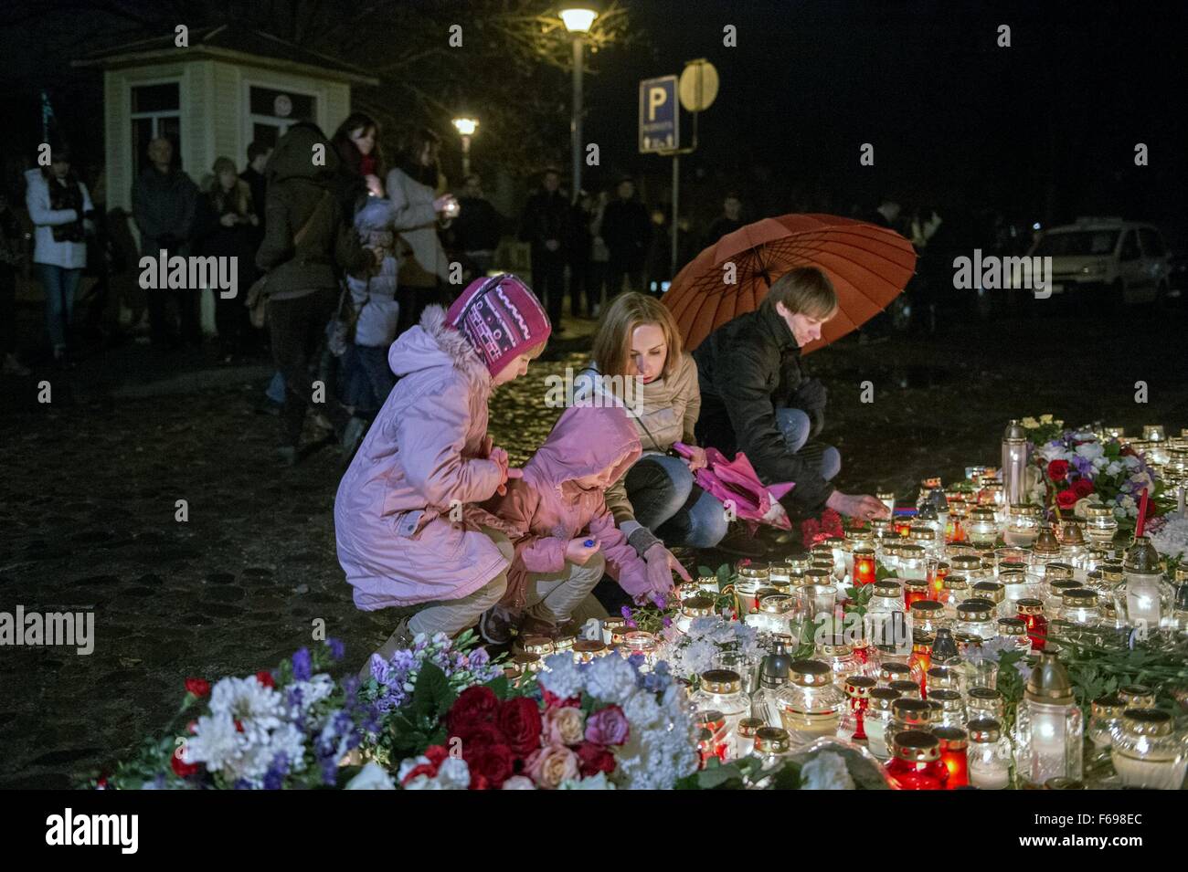 Vilnius. 14th Nov, 2015. Lithuanian people place flowers and candles in front of French embassy in Vilnius, Lithuania, Nov. 14, 2015, to mourn victims of a series of attacks that happened in Paris on Friday night. Credit:  Alfredas Pliadis/Xinhua/Alamy Live News Stock Photo