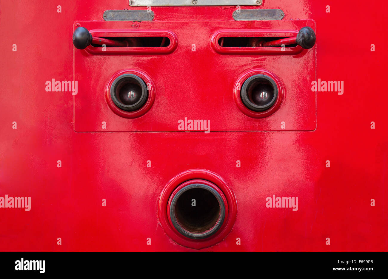 Valve control of fire truck look like human face Stock Photo