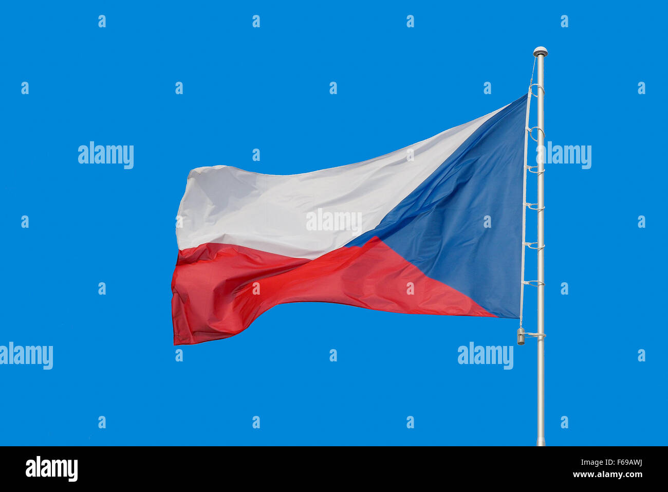 Flag of Czech Republic on pole, with text space around it and blue sky background. Stock Photo