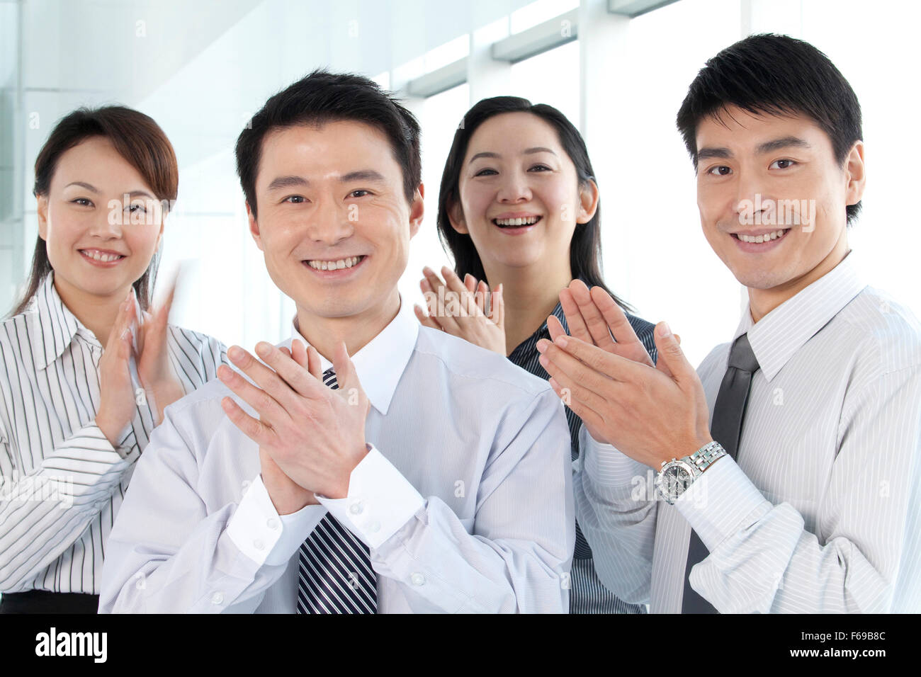 Group of Businesspeople Clapping Stock Photo - Alamy