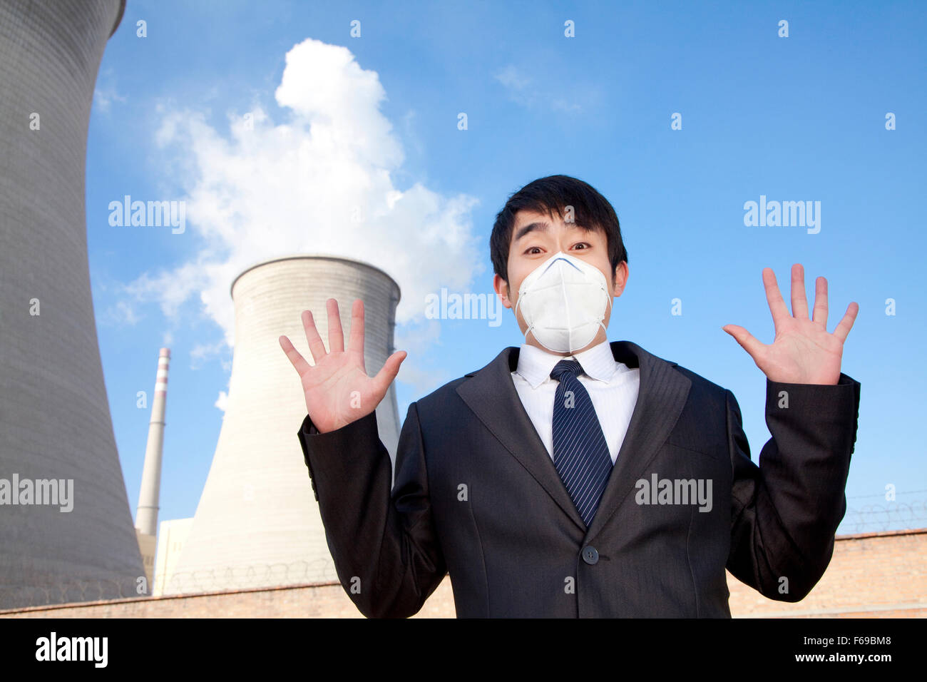 Businessman at power plant with face mask Stock Photo Alamy