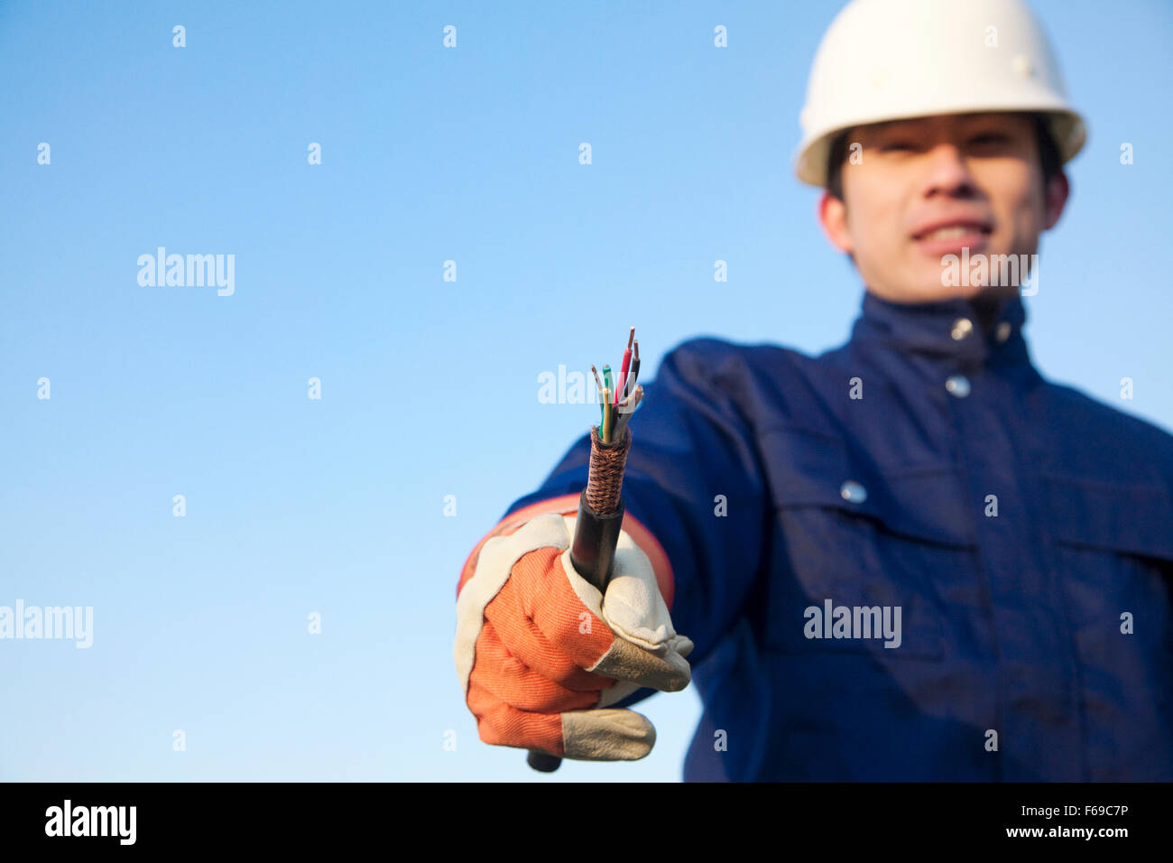 Manual worker with frayed wire Stock Photo