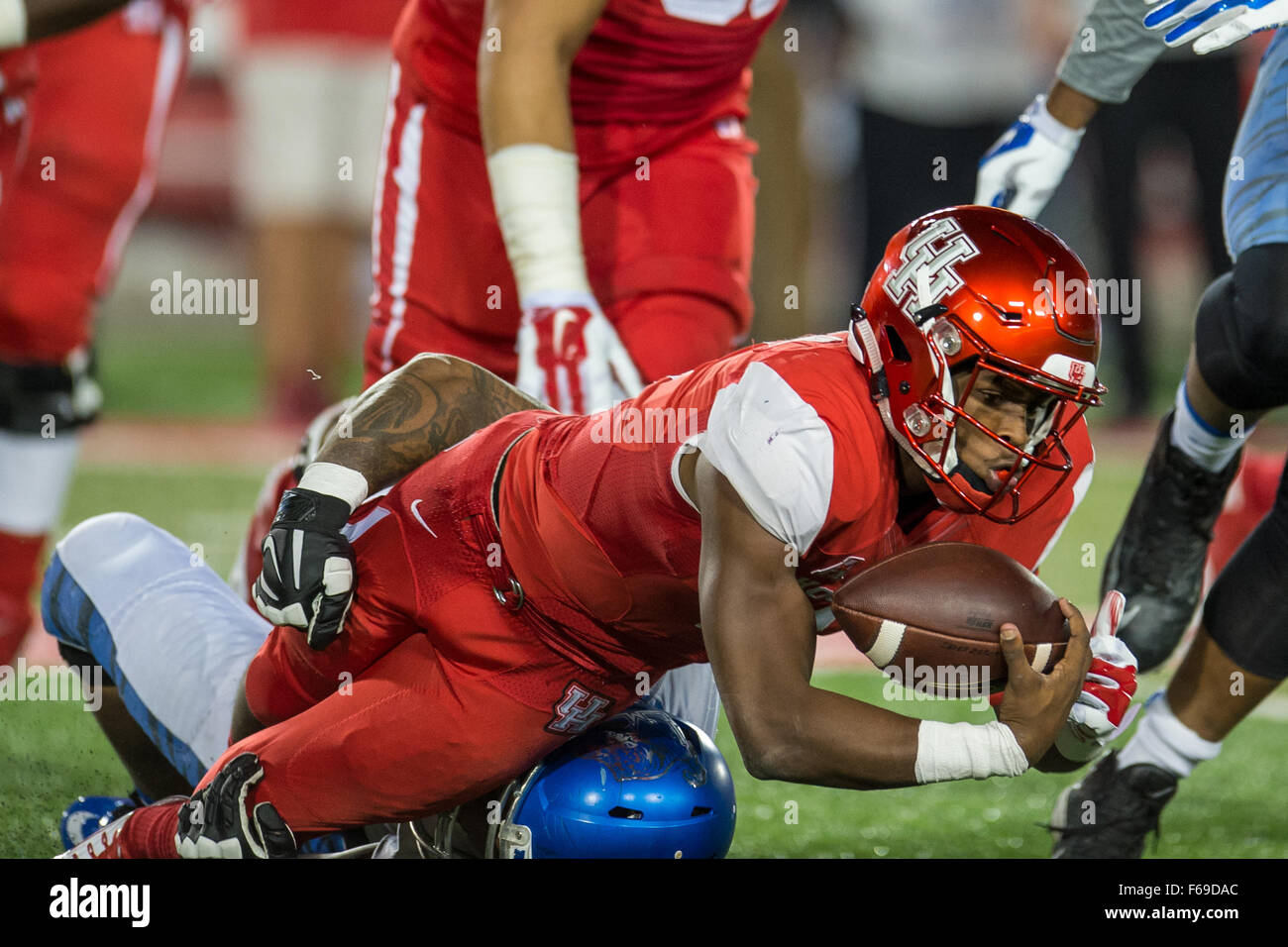 Houston, TX, USA. 14th Nov, 2015. Houston Cougars quarterback Greg Ward Jr. (1) is sacked by Memphis Tigers defensive lineman Ernest Suttles (48) during the 2nd quarter of an NCAA football game between the Memphis Tigers and the University of Houston Cougars at TDECU Stadium in Houston, TX.Trask Smith/CSM/Alamy Live News Stock Photo