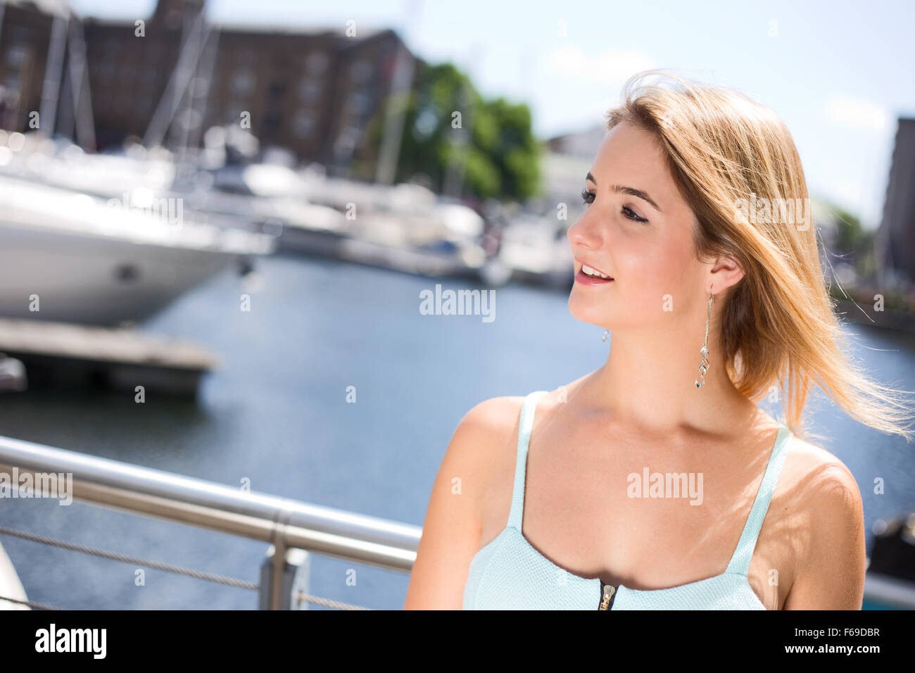 portrait of a young woman by the marina Stock Photo