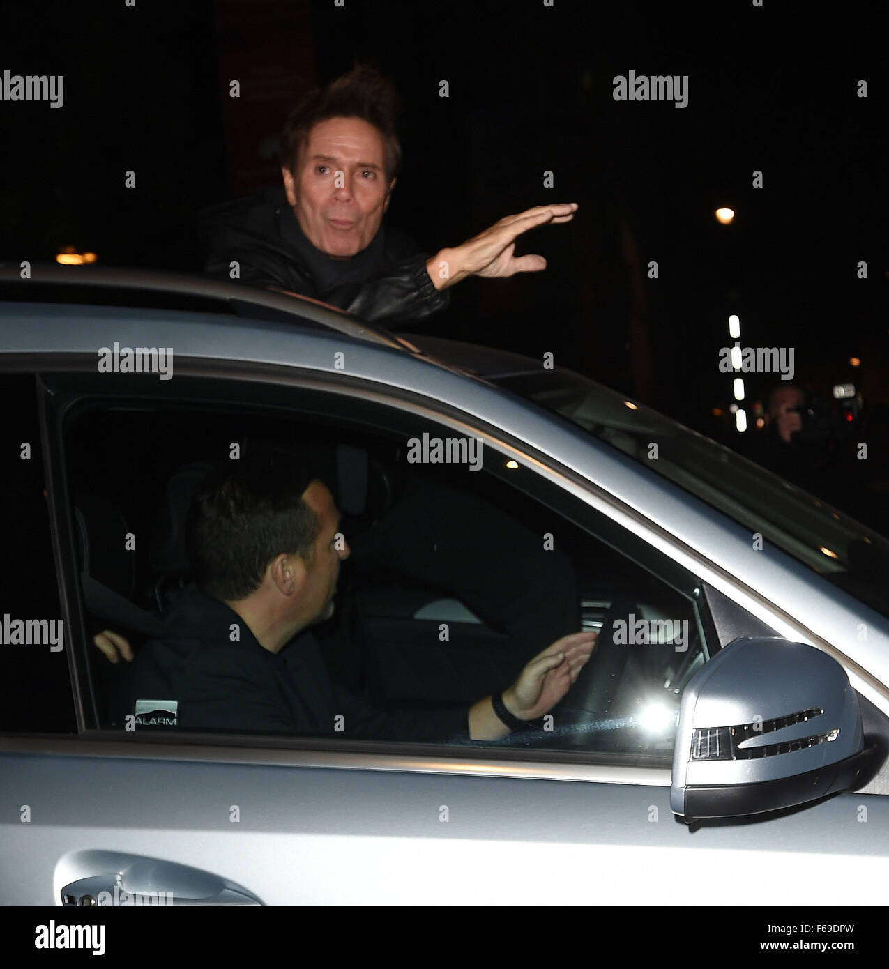 Pop singer Cliff Richard seen leaving the Royal Albert Hall and arriving at his London hotel. Cliff, who just turned 75 years old, was seen greeting his fans through the sun roof of his vehicle  Featuring: Sir Cliff Richard Where: London, United Kingdom W Stock Photo