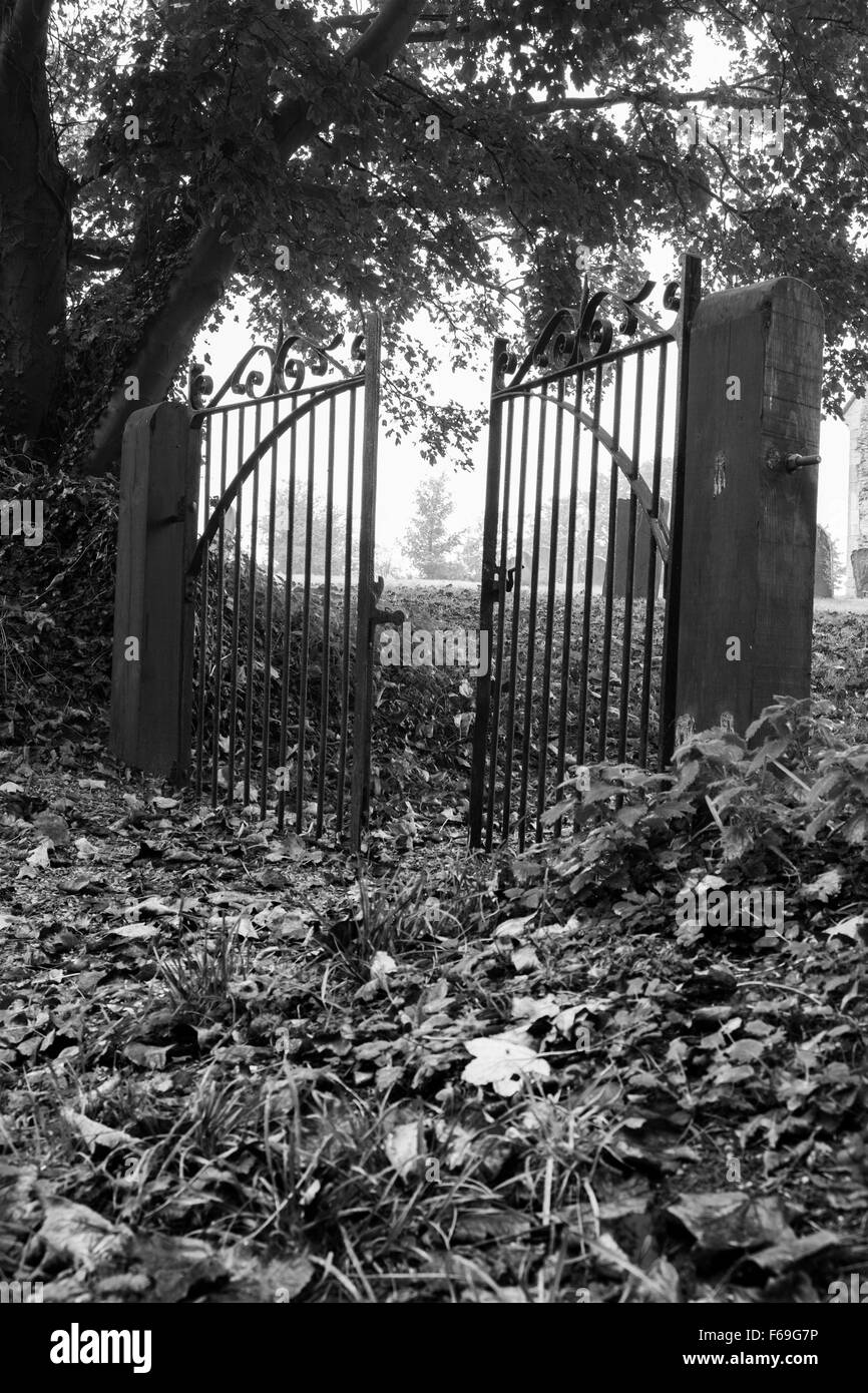 Wrought iron gates leading to churchyard England UK Stock Photo Alamy