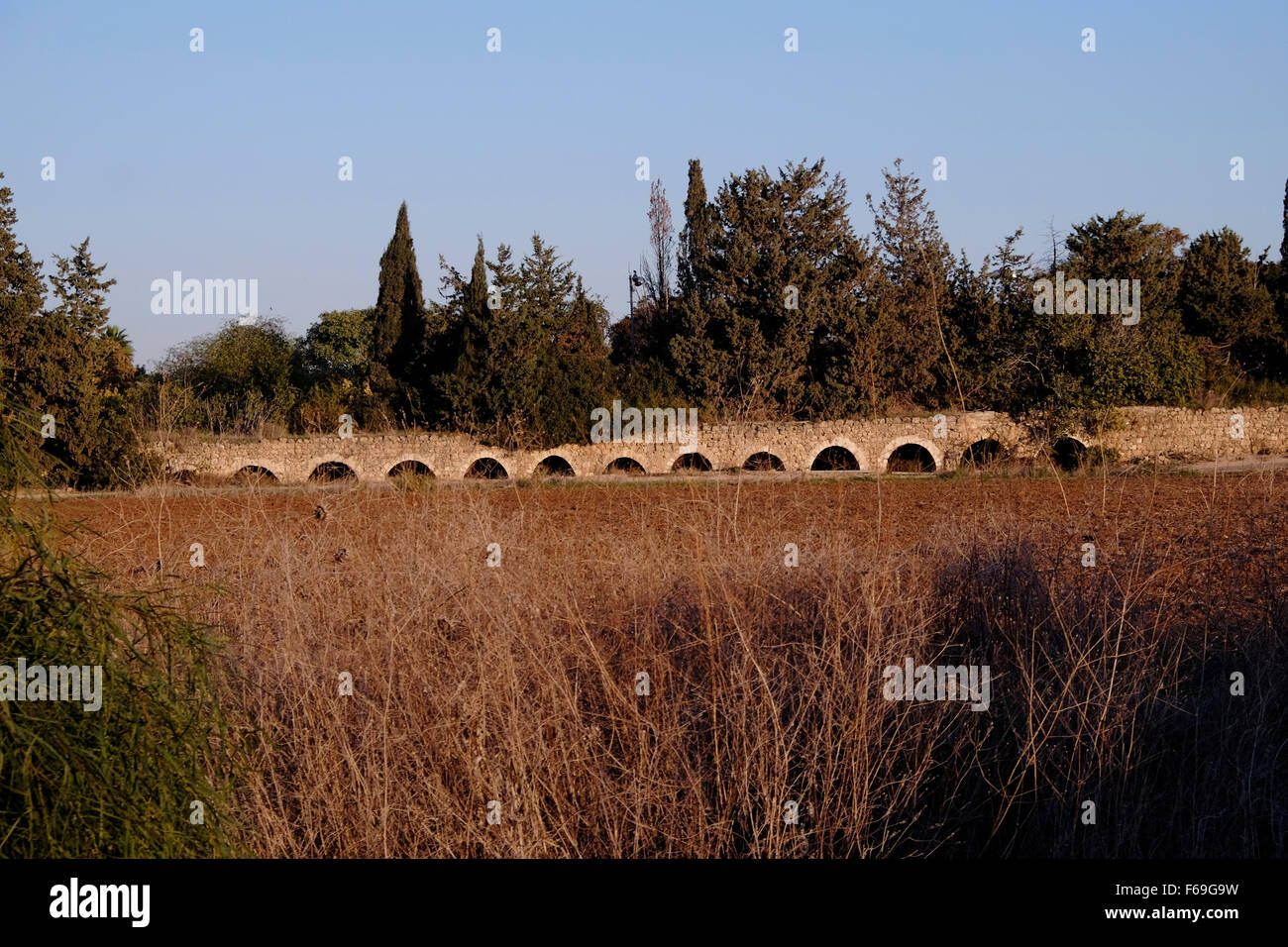 An old Ottoman aqueduct at Kibbutz Lohamei HaGeta'ot near Acre in Israel Stock Photo