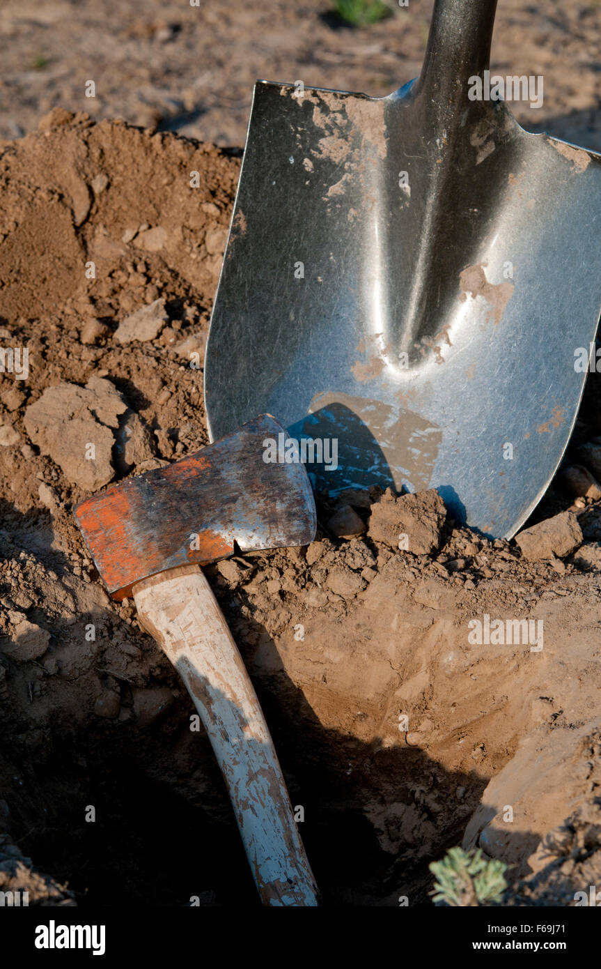 Conceptual image - bury the hatchet Stock Photo