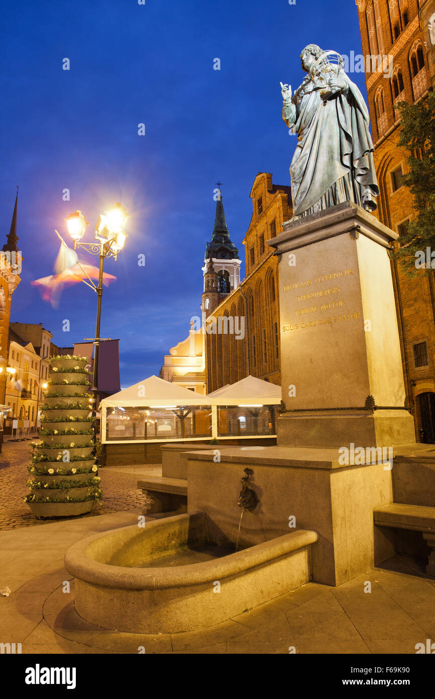 Poland, Torun, Nicolaus Copernicus monument at night in Old Town, erected in 1853. Stock Photo