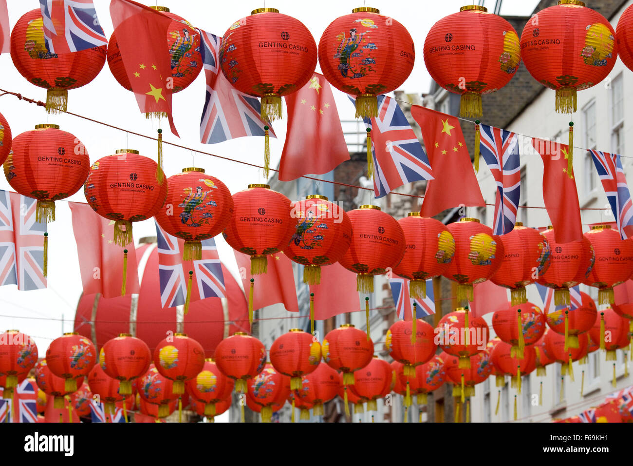 Union Jack bunting and Chinese flag bunting hanging in China Town London Stock Photo