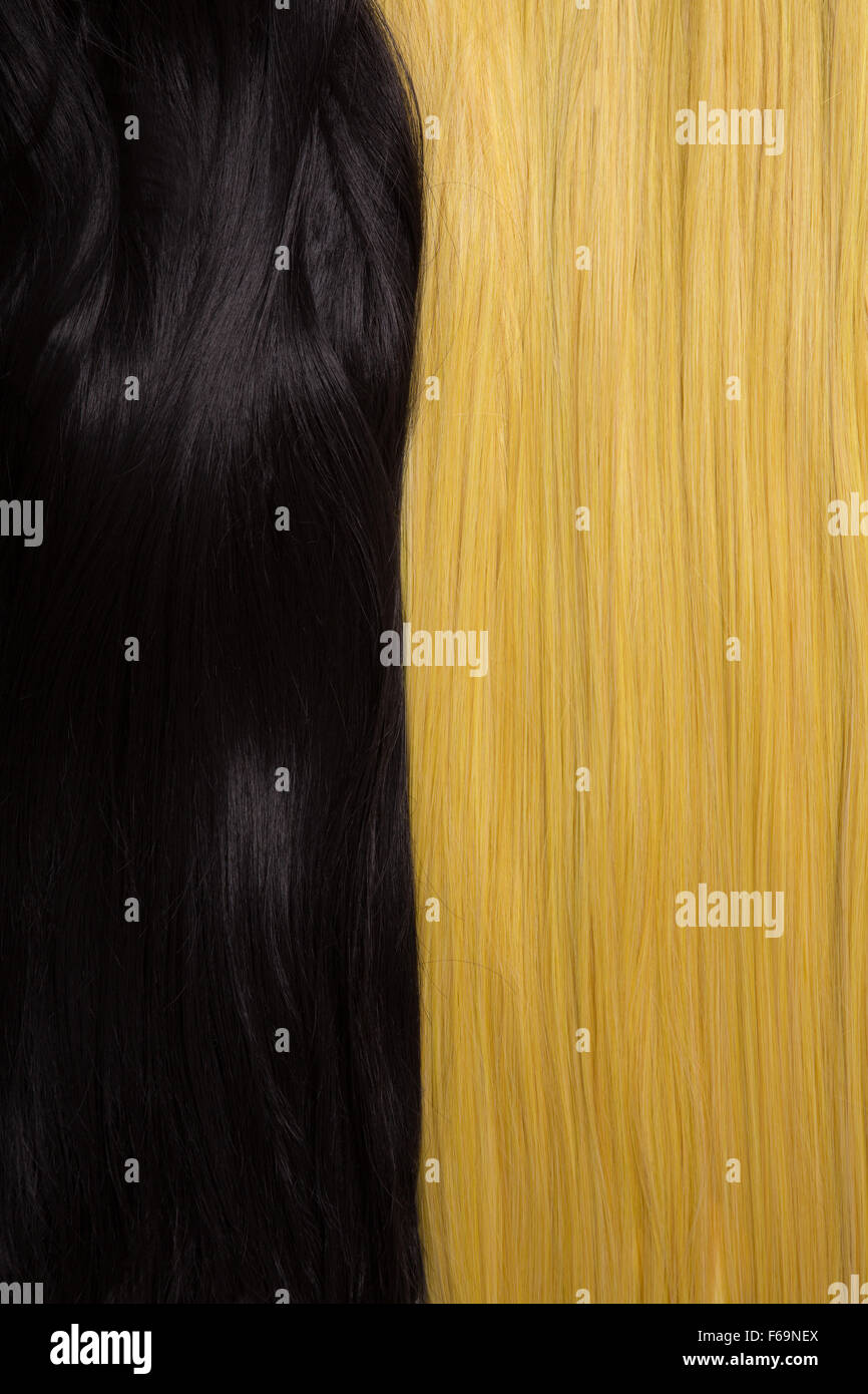 Texture of black and golden blond hair, soft focus Stock Photo