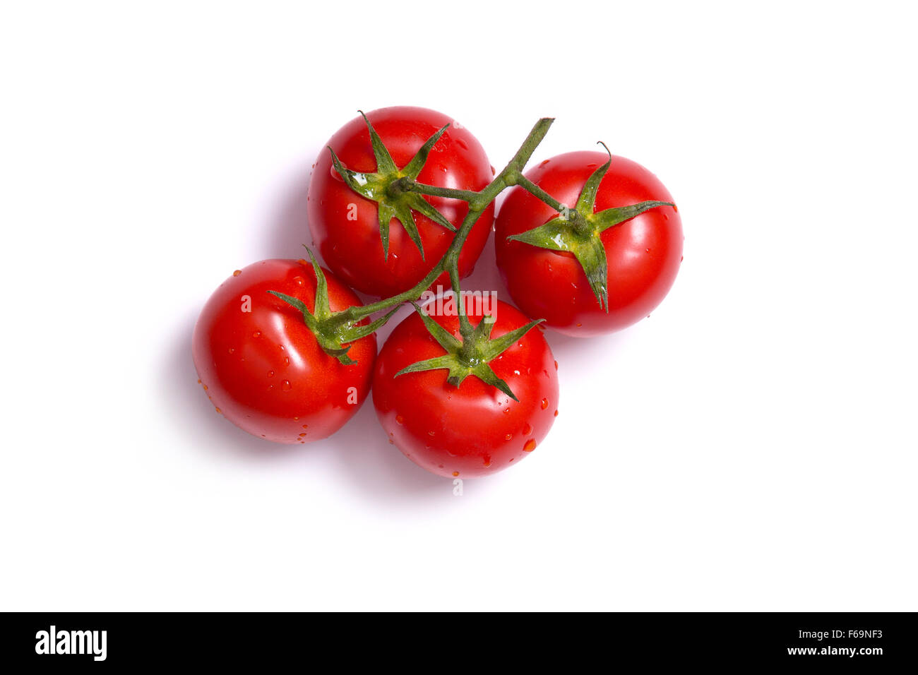Top view on bunch of fresh tomatoes, isolated on white background Stock Photo