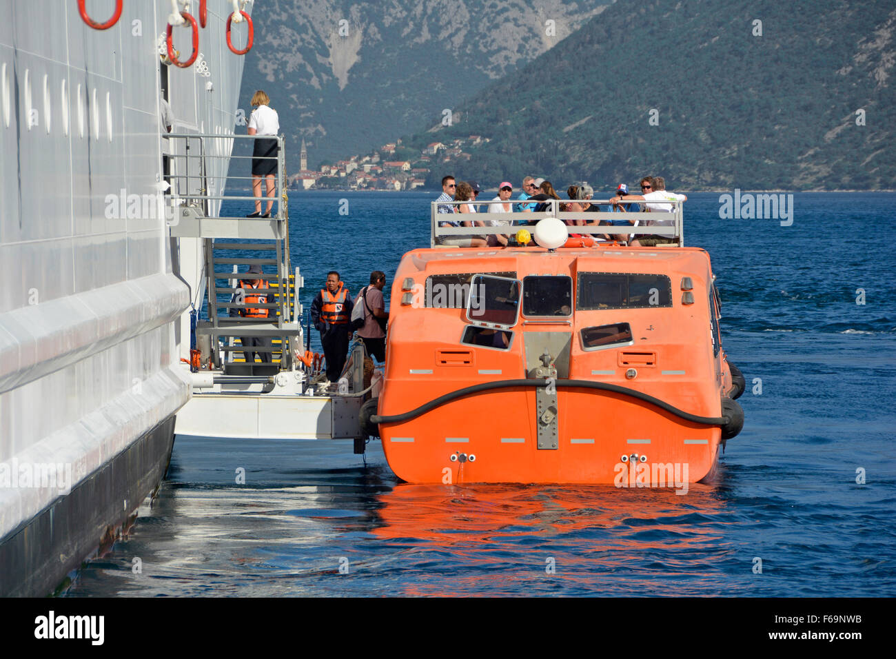 Cruise ship liner anchored Bay of Kotor crew loading passengers for