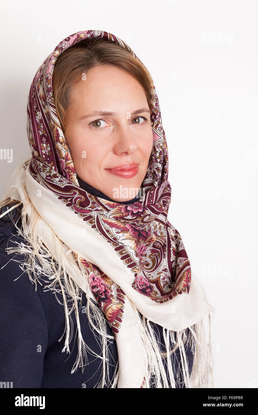 Portrait of smiling Young Caucasian woman in traditional Russian Pavloposadskie scarf on head Stock Photo