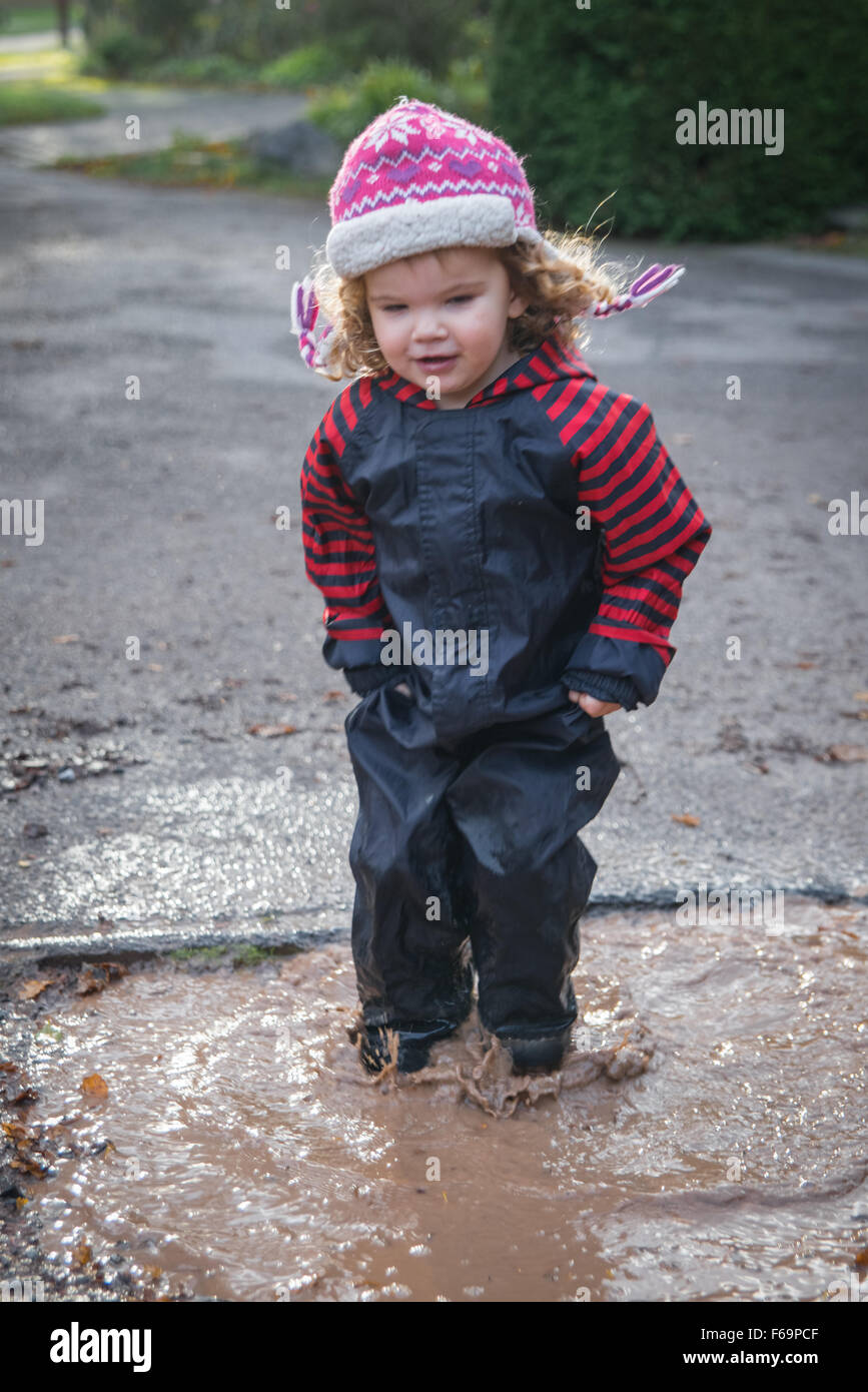 Kids jumping in puddles hi-res stock photography and images - Alamy