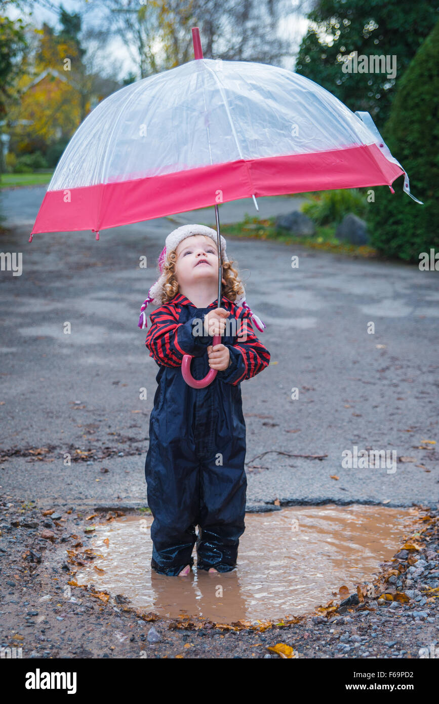 Kids jumping in puddles hi-res stock photography and images - Alamy