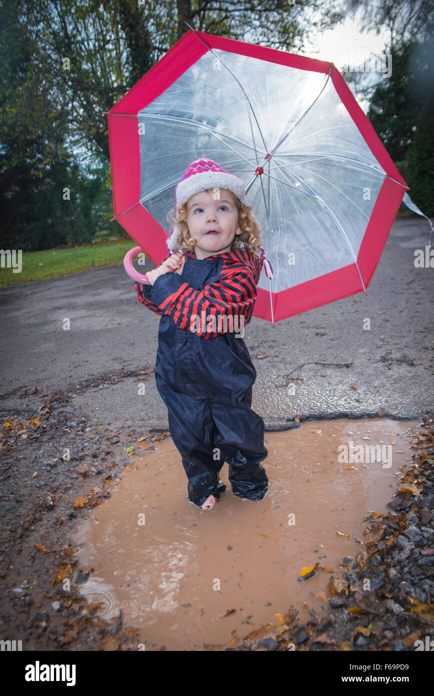 Kids jumping in puddles hi-res stock photography and images - Alamy