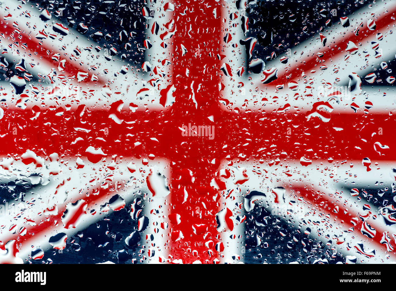 United Kingdom's Union Jack flag seen through a rainy window Stock Photo