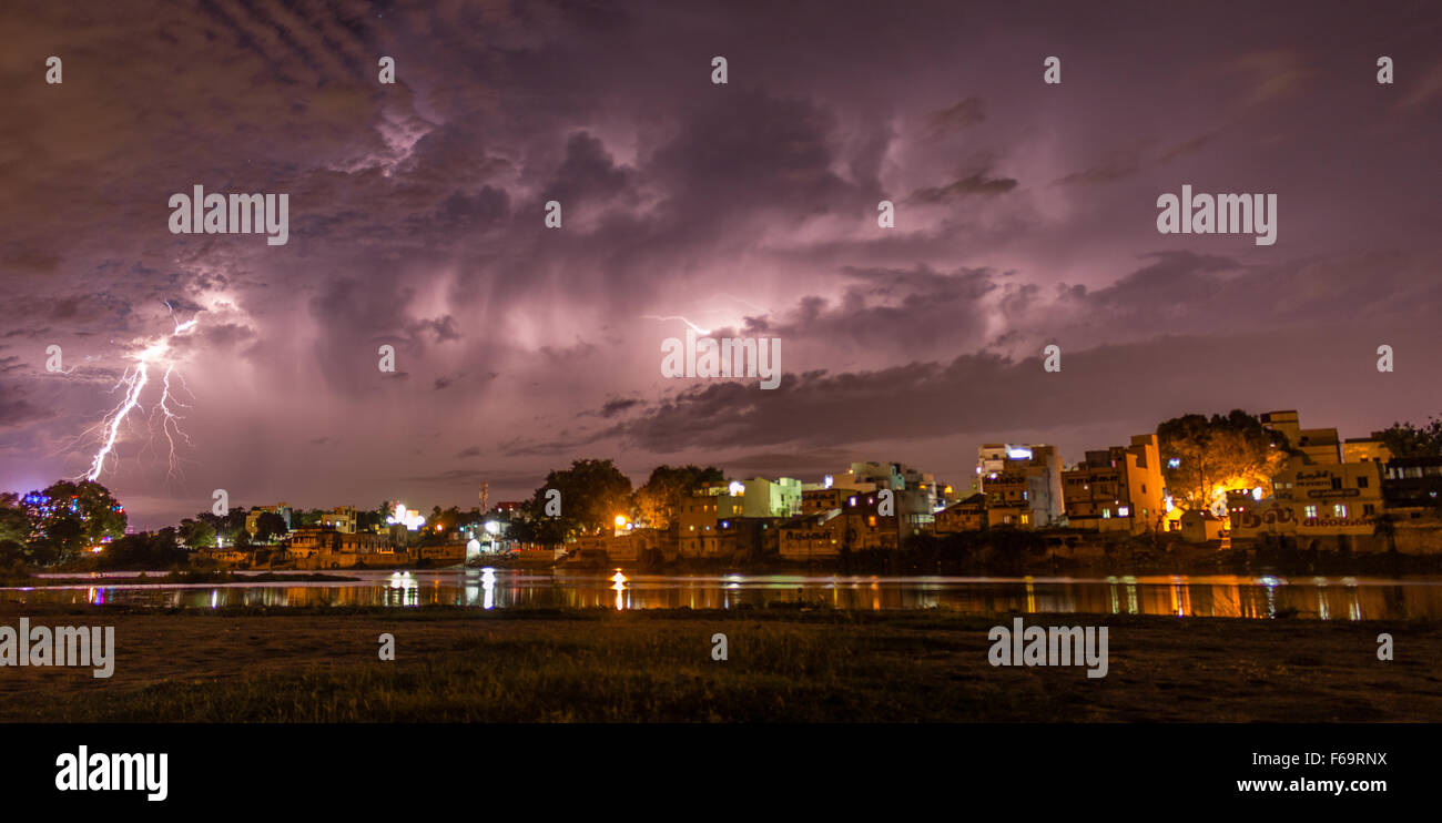 A thunder this striking is positively drowning the city lights. Stock Photo