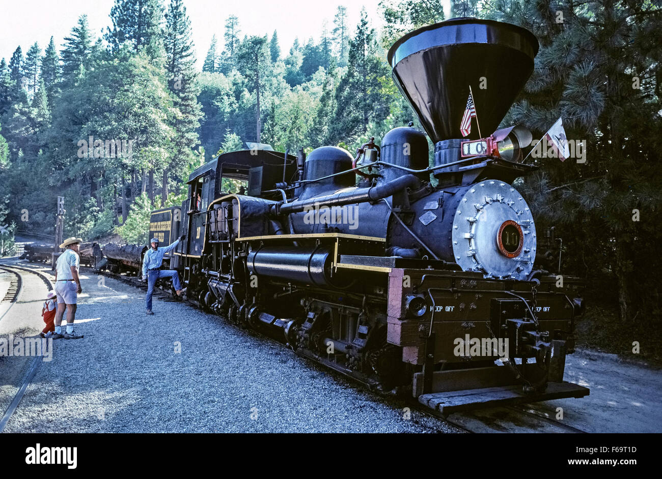 Visitors can experience bygone days in the Sierra National Forest by riding a logging train pulled by an historic steam locomotive operated by the Yosemite Mountain Sugar Pine Railroad from Fish Camp in California, USA. This Shay engine No. 10 was built in 1928 in Lima, Ohio, weighs 84 tons, and makes four-mile, hour-long excursions March through October. Stock Photo