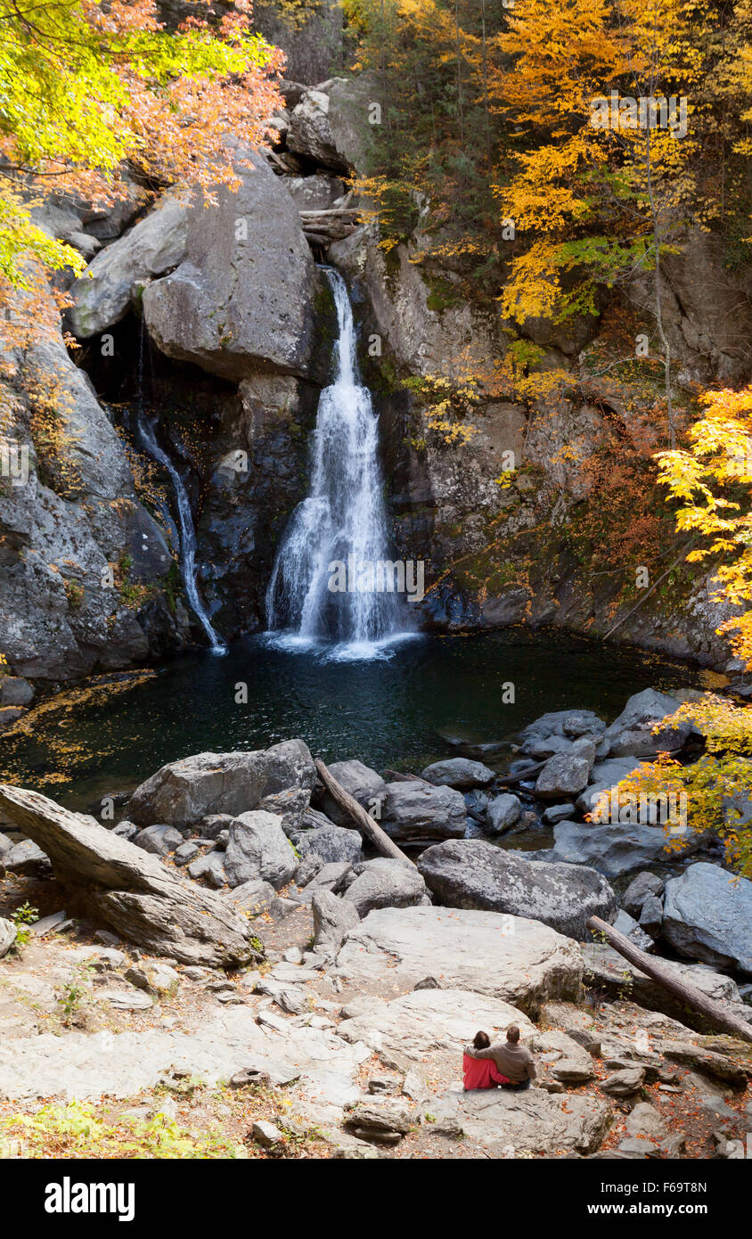A couple sitting looking at the Bash Bish Falls, Bash Bish State Park