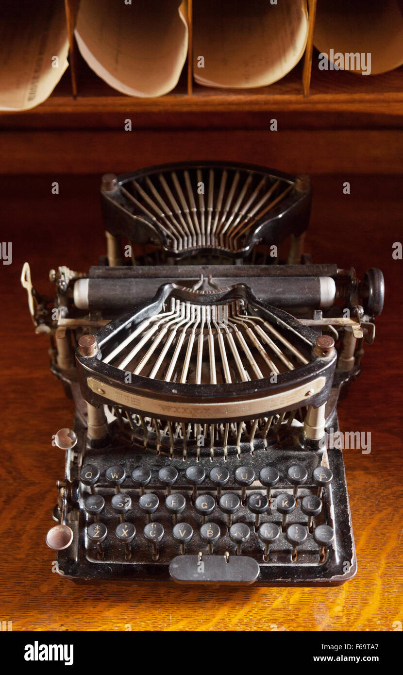 Vintage antique typewriter from the early 20th century on a desk, Billings Farm, Woodstock,  Vermont VT USA Stock Photo