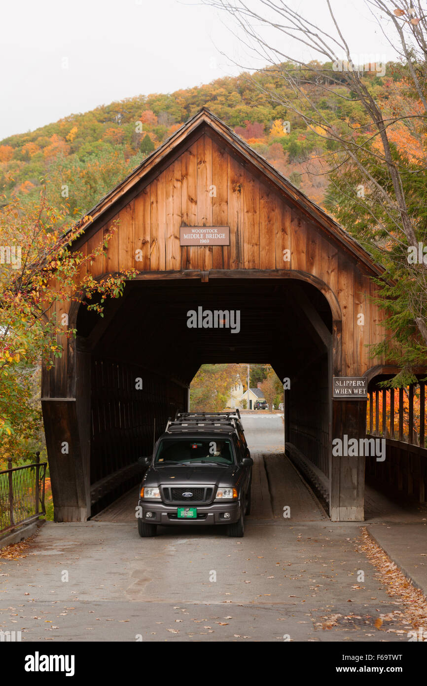 A car driving through Woodstock Middle covered bridge, Woodstock, Vermont VT USA Stock Photo