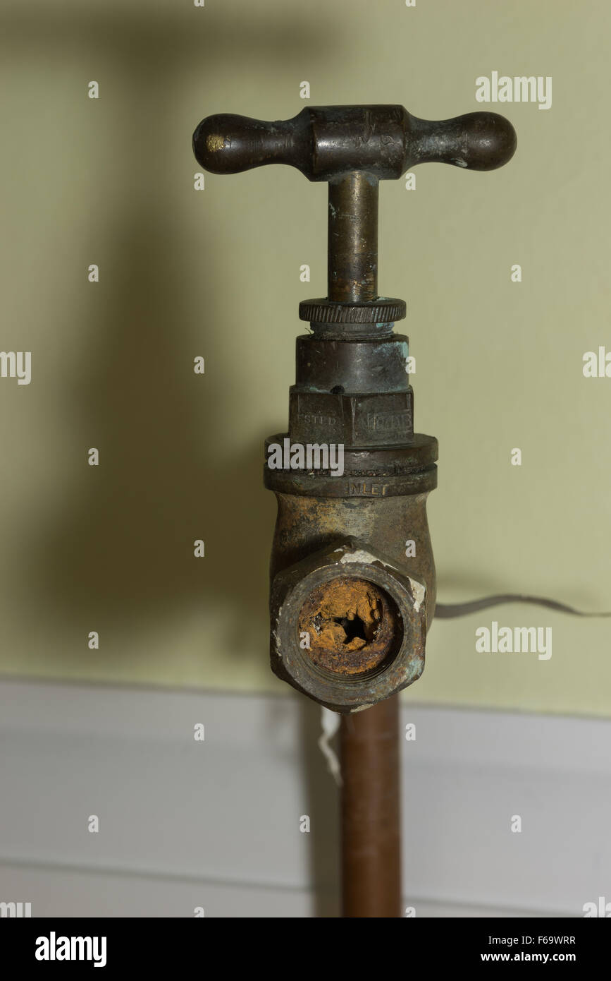 Cause of blocked mains stop cock hard water calcium carbonate deposits and rust from steel pipes