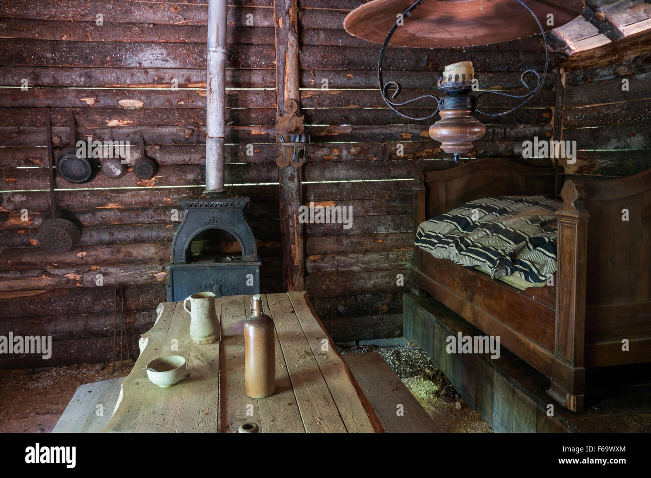 Rustic log cabin interior with wooden furniture Stock Photo