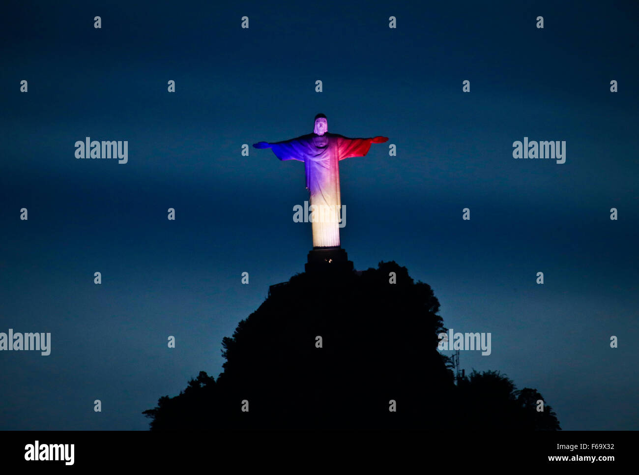 Rio De Janeiro, Brazil. 14th Nov, 2015. The Christ the Redeemer statue is illuminated with the colors of the French national flag to mourn for the victims of the terrorist attacks in Paris, in Rio de Janeiro, Brazil, Nov. 14, 2015. Credit:  AGENCIA ESTADO/Xinhua/Alamy Live News Stock Photo