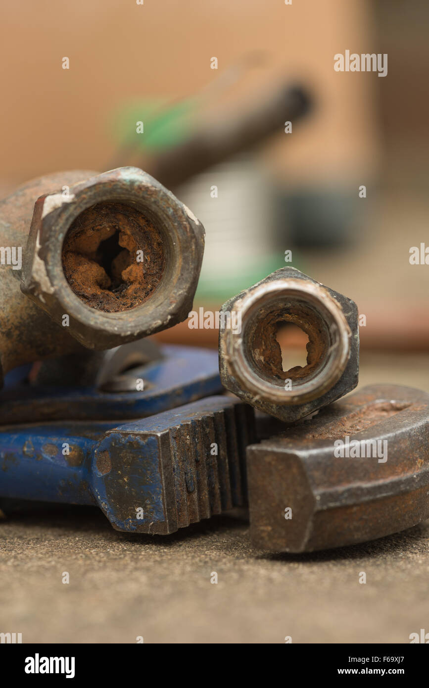 Cause of blocked mains stop cock hard water calcium carbonate deposits and rust from steel pipes