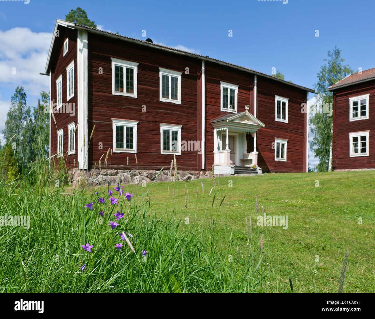 HALSINGLAND, SWEDEN ON JULY 24, 2015. View of a beautiful wooden homestead. UNESCO World Heritage Site. Flowers. Editorial use. Stock Photo