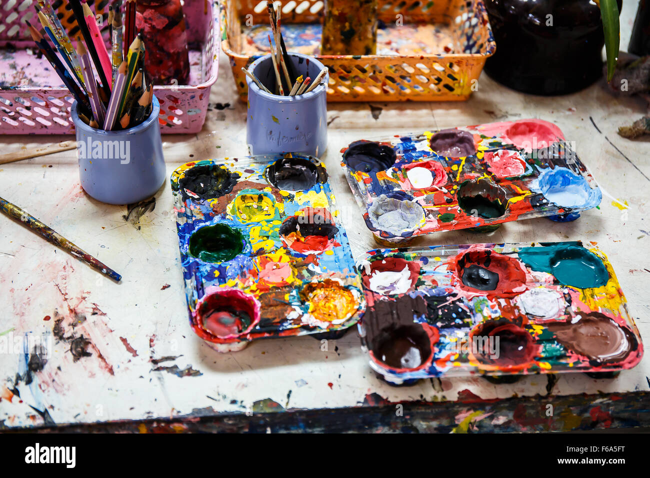 Paints and brushes on table Stock Photo Alamy