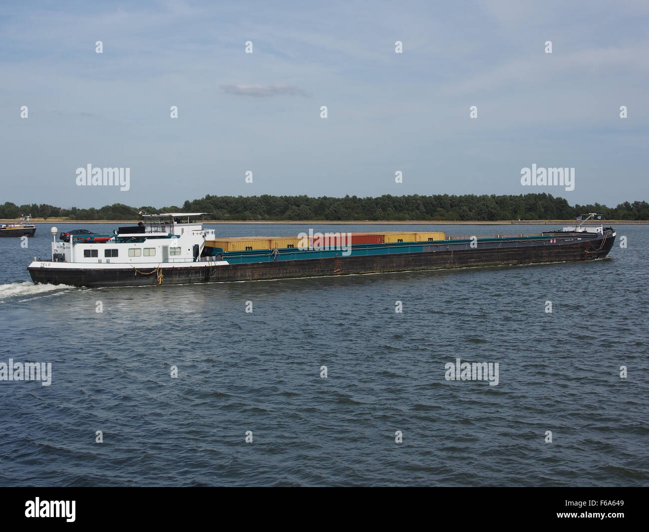 A scene depicting logistics operations at the Port of Antwerp, showing container ships, tankers, and cargo handling at one of Europe's busiest ports. Stock Photo