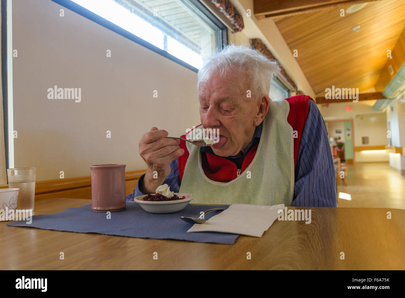 Man in Dementia Care Home eating lunch. Stock Photo