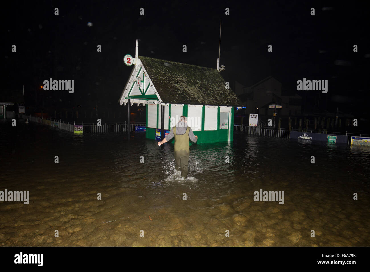 Lake Windermere  Cumbria 15th  November  2015 UK Weather  .Windermere Lake Cruise tickect offices submerged  .Lakes cruises ,staff  stip out tickect offices of equipment ,as water is still riseing at aprox 4to 6 inches an hour  Credit:  Gordon Shoosmith/Alamy Live News Stock Photo