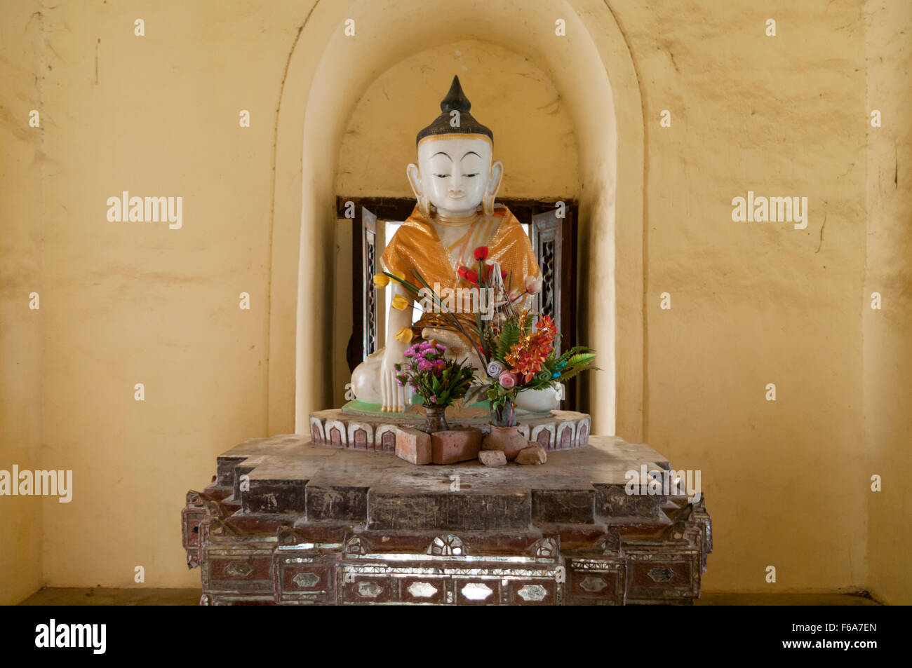 Buddha statue in earth touching pose in the Maha Aungmye Bonzan buddhist monastery in Inwa (Awa), Myanmar. Stock Photo