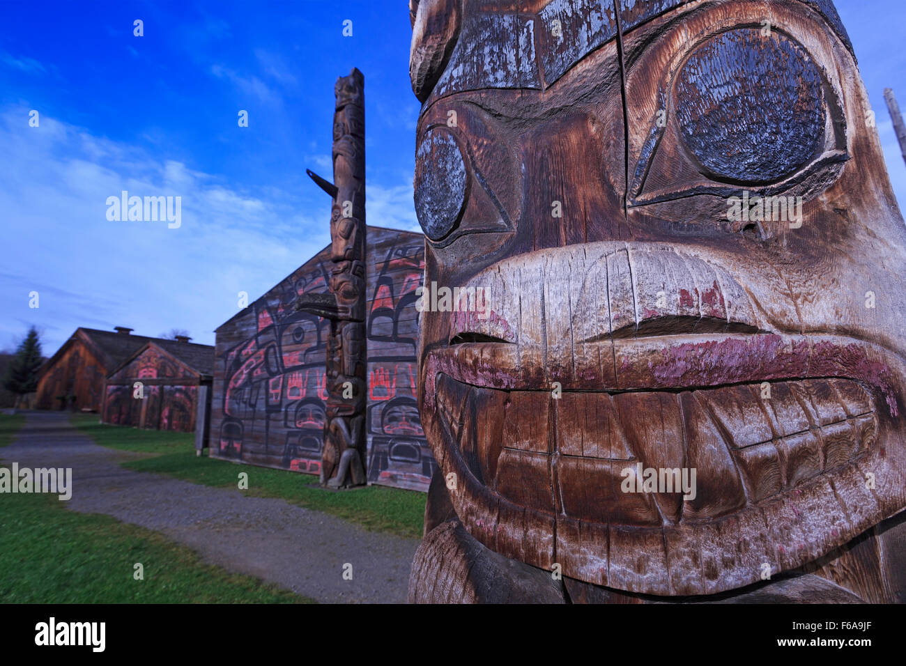 Totem pole and long houses at Ksan Historical Village and Museum, Hazelton, British Columbia Stock Photo