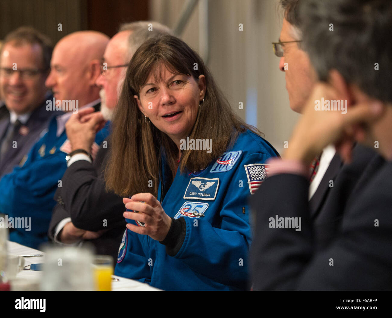 NASA astronaut Cady Coleman discusses space exploration with fellow astronauts Terry Virts, Mark Kelly, and Scott Kelly, who was aboard the International Space Station. The discussion took place at the National Press Club, Washington D.C., in 2015. Stock Photo