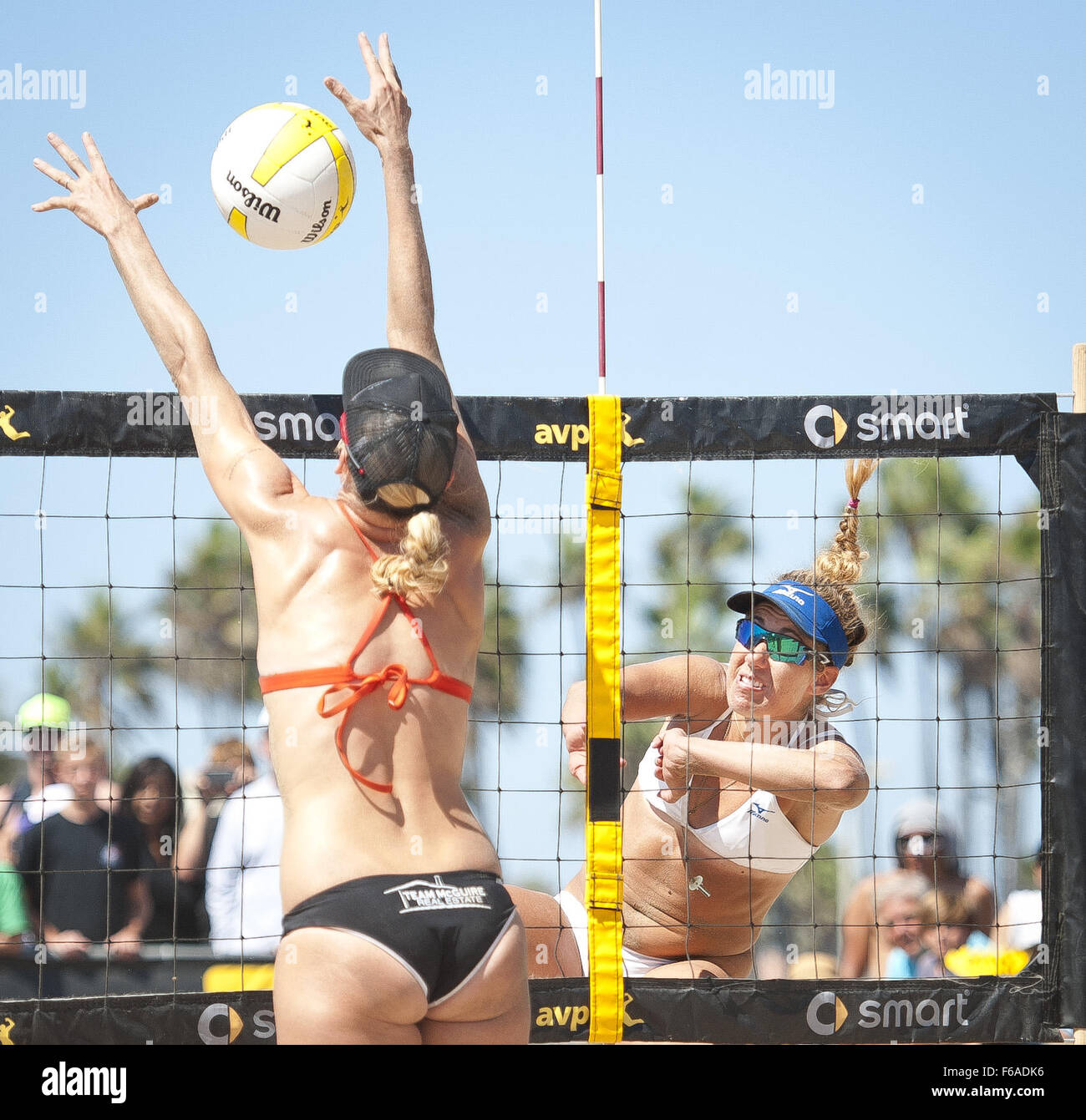 Huntington Beach, California, USA. 21st Sep, 2014. APRIL ROSS with a spike high on the net as HEATHER HUGHES attempts the block on Sunday afternoon ---The AVP Championship Final for men and women ran on Sunday at the Huntington Beach Pier. April Ross, along with teammate Kerri Walsh Jennings took the overall final championship over Heather Hughes and Whitney Pavlik on Sunday afternoon in the women's division. © David Bro/ZUMA Wire/Alamy Live News Stock Photo