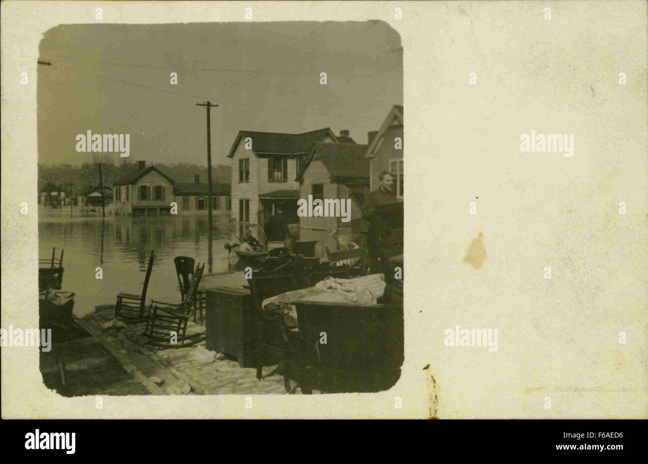 This image depicts furniture that was rescued, likely after a disaster or flood, highlighting the efforts to save belongings and recover items of sentimental or financial value. Stock Photo