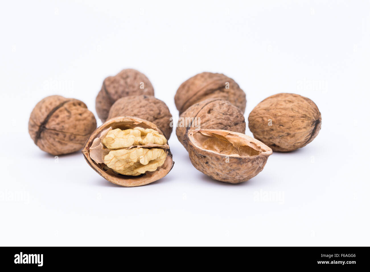 Image shows some walnuts isolated on white background Stock Photo