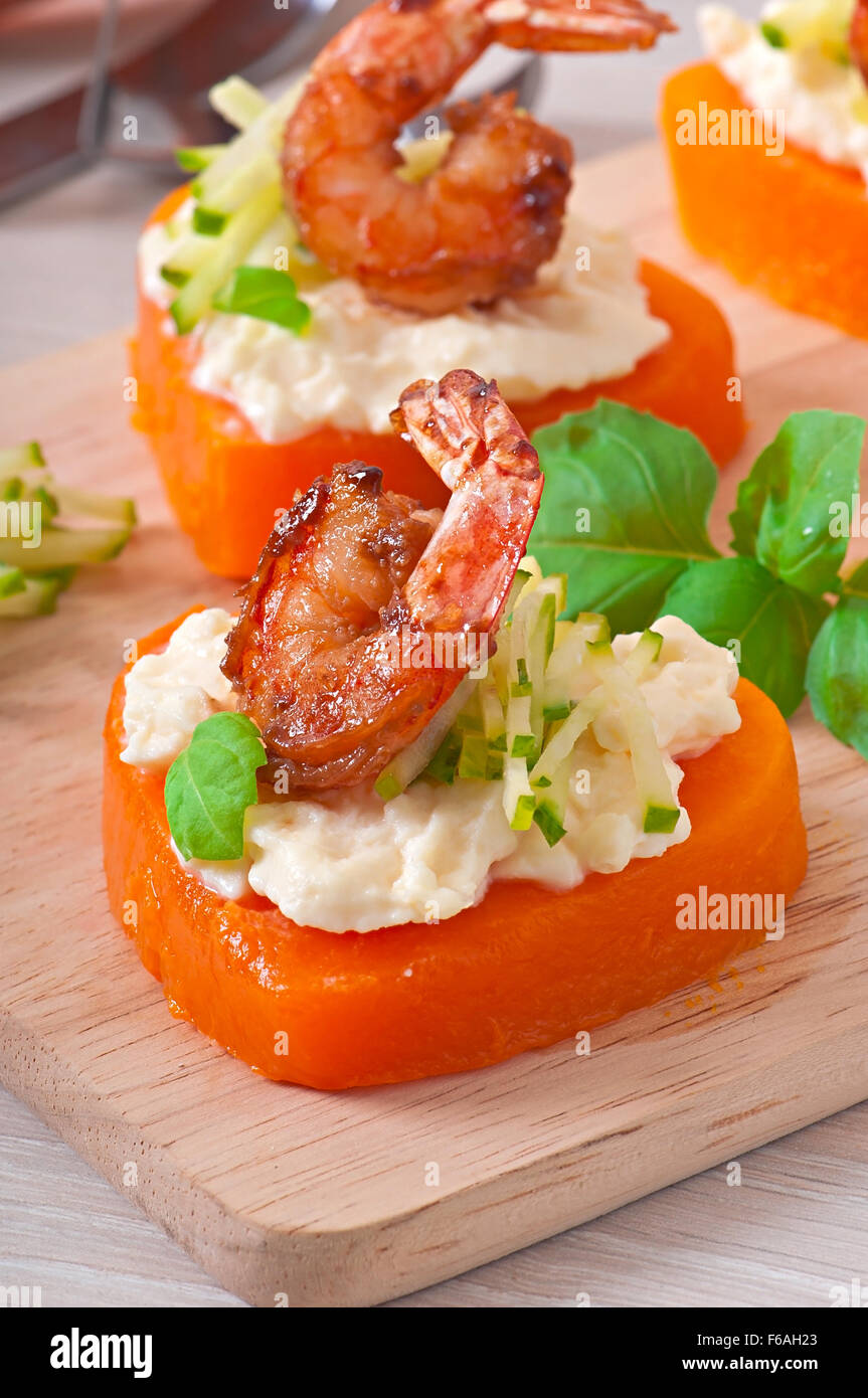 Appetizer of shrimp and cream cheese on pumpkin hearts Stock Photo Alamy