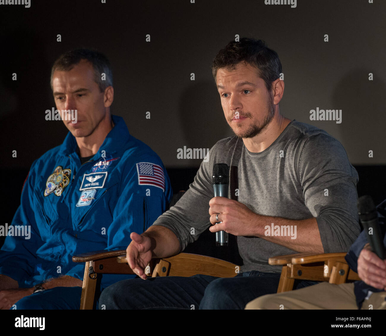 Actor Matt Damon talks, as NASA Astronaut Drew Feustel looks on, during a question and answer session about NASA’s journey to Mars and the film ”The Martian,” Tuesday, Aug. 18, 2015, at the United Artist Theater in La Cañada Flintridge, California. NASA scientists and engineers served as technical consultants on the film. The movie portrays a realistic view of the climate and topography of Mars, based on NASA data, and some of the challenges NASA faces as we prepare for human exploration of the Red Planet in the 2030s. Photo Credit: (NASA/Bill Ingalls) Stock Photo